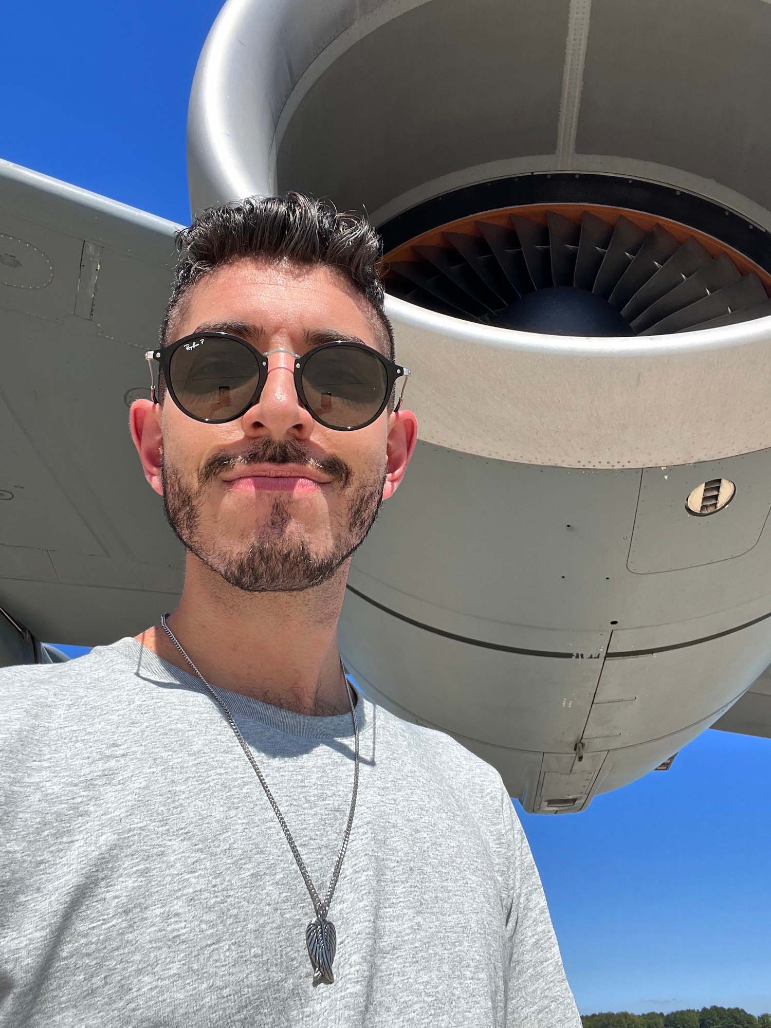 Rocky beside an airplane engine