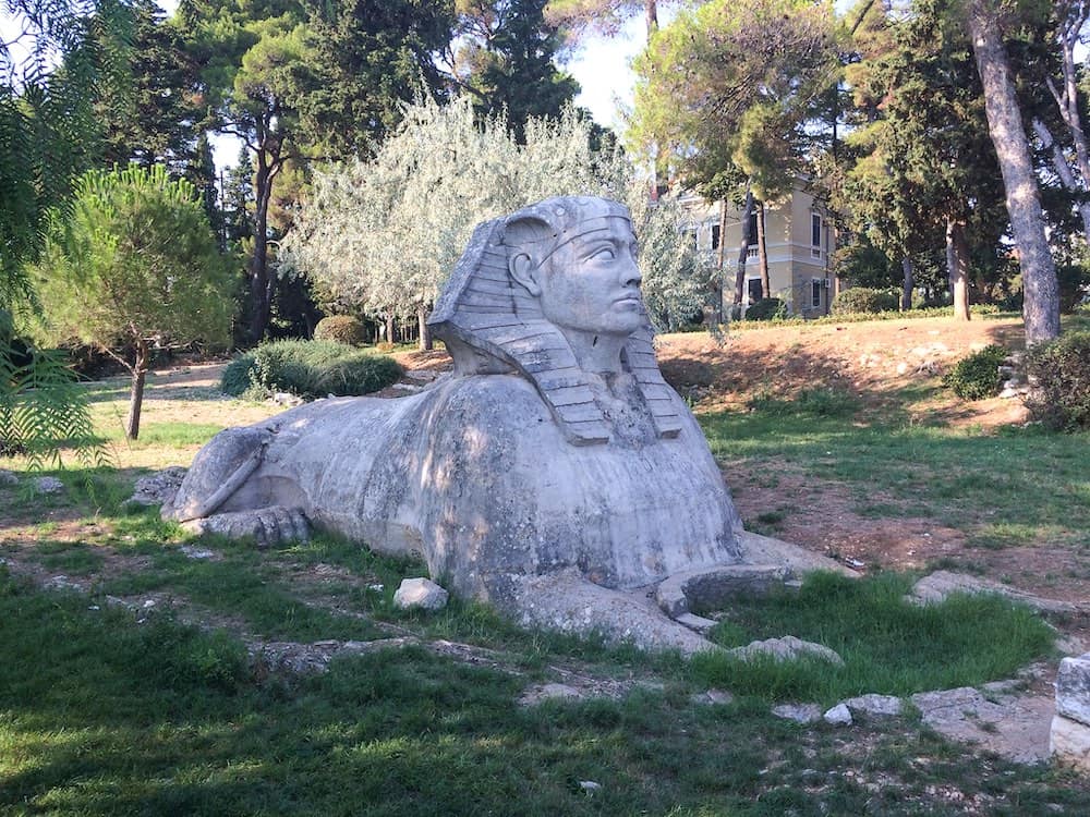 The sphinx with Villa Attilia behind it