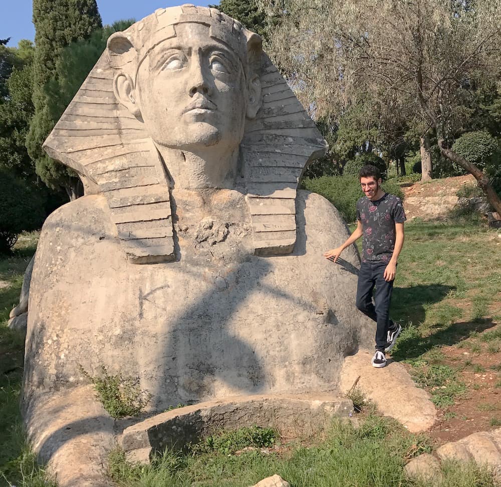 A hand resting on the head of the Zadar sphinx