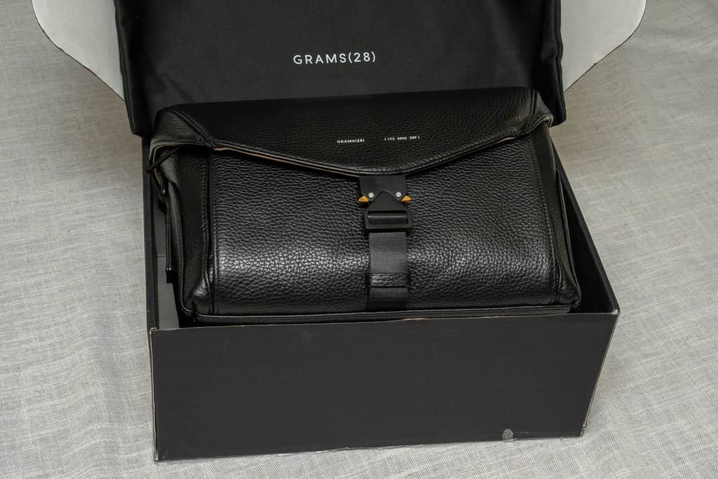 The 172 Camera Sling by Grams28 in its shipping box