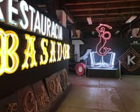 A wall of restored Cold War era neon signs glowing in the dark