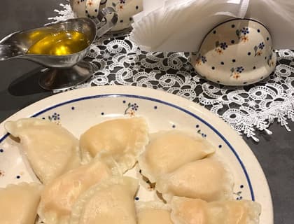 Boiled pierogi on a patterned plate