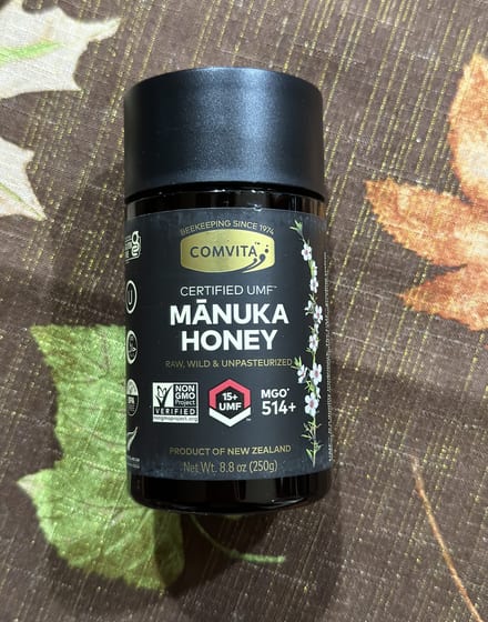 A jar of Comvita certified UMF 15+ MGO 514+ Manuka honey, product of New Zealand