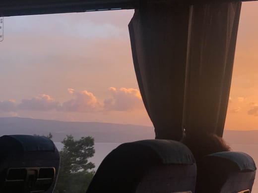The view from a bus window at sunset on the road into Bosnia