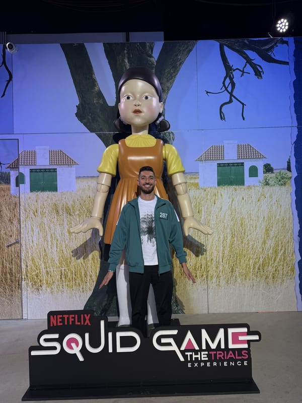 Rocky posing beside the Young-hee doll standee in the Night Market