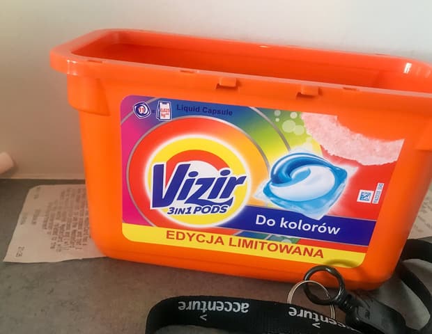 A bag of orange Vizir laundry pods on a Polish supermarket shelf