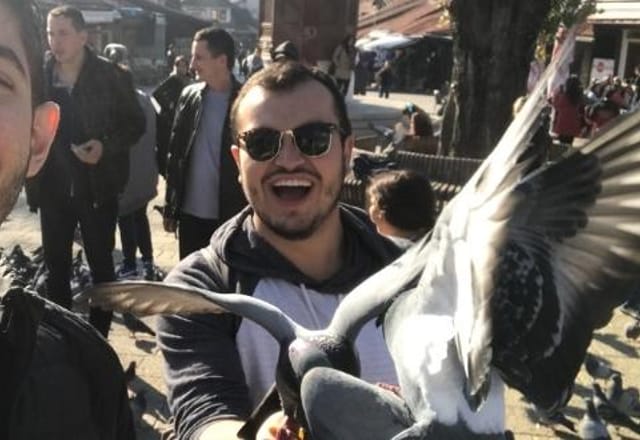 Feeding Pigeons at Baščaršija Pigeon Square