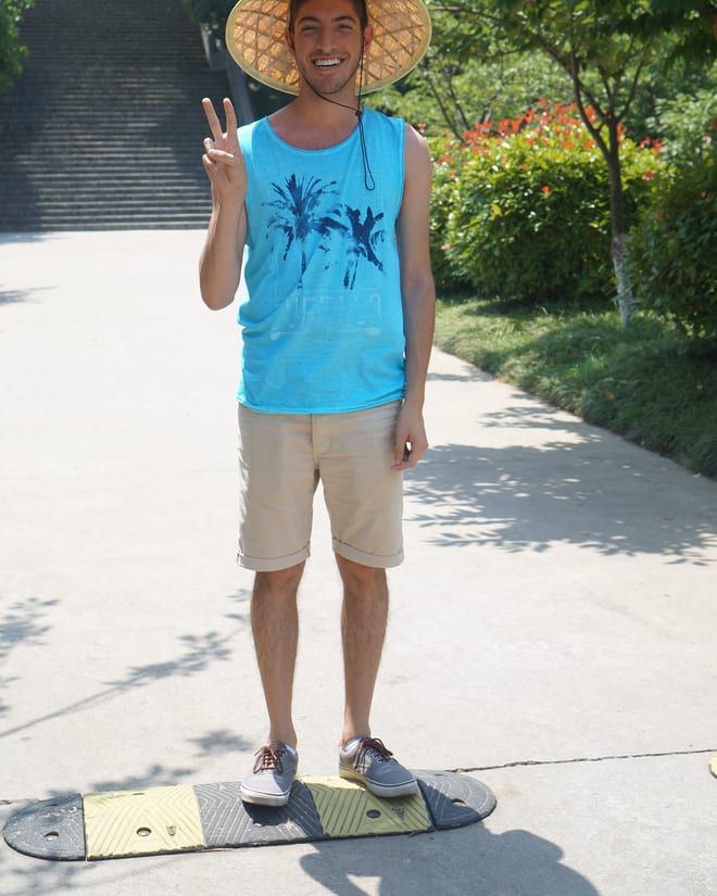 Rocky wearing the straw hat he bought in Wuxi