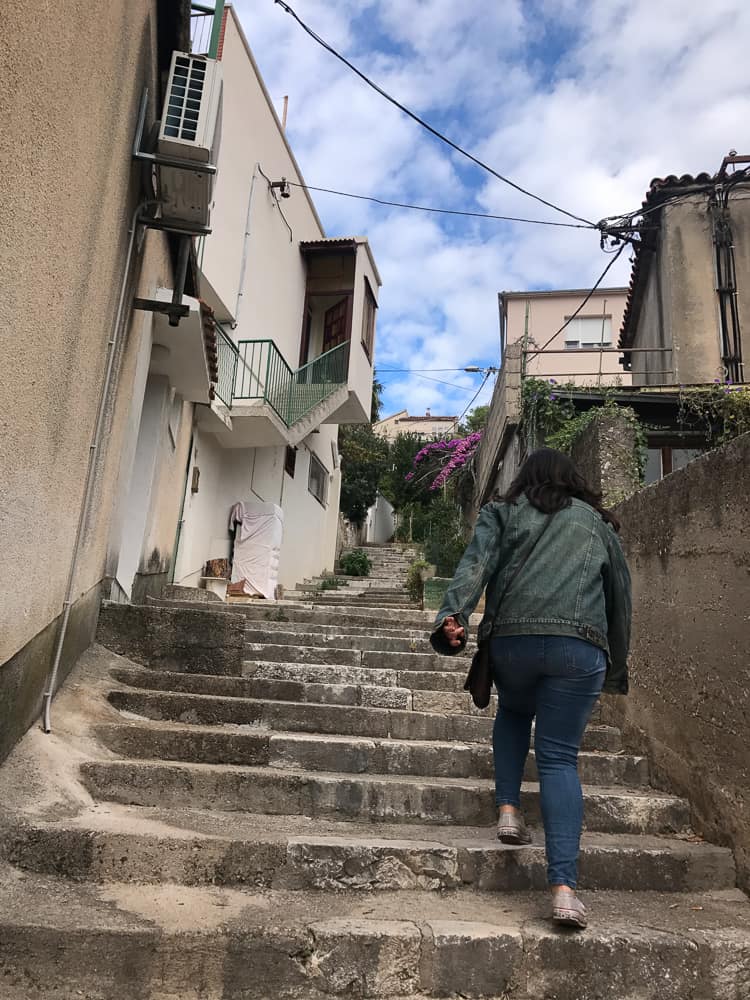 A steep stone stairway between buildings in Šibenik