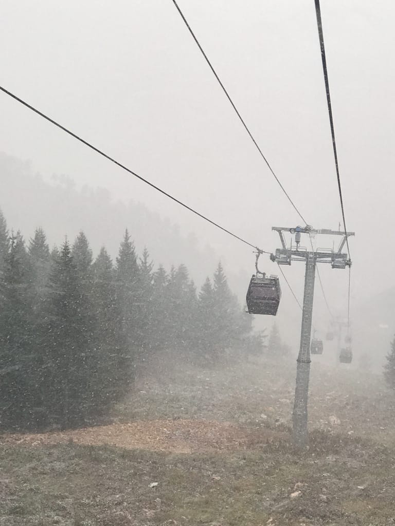 Riding the cable car home in the snow