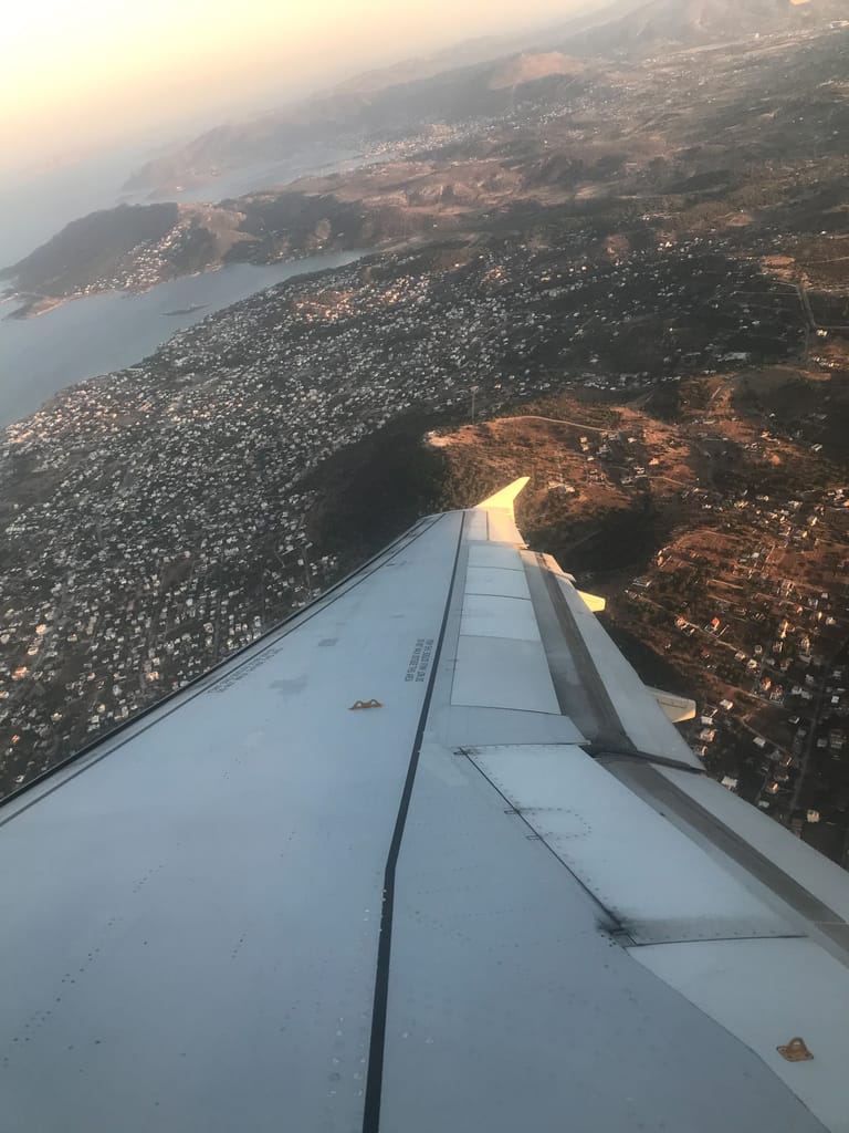 Plane flies over Mykonos