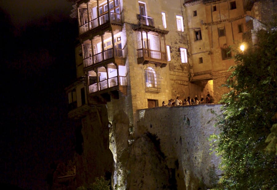 The Casas Colgadas, the hanging houses of Cuenca, Spain, lit up at night